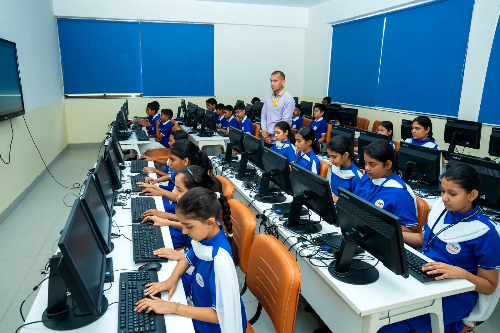 Students at individual computer workstations in the ICT computer lab