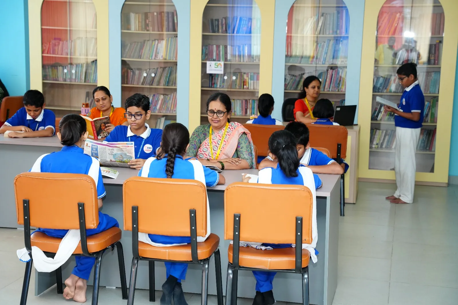 The library and reading room, with students reading at study tables