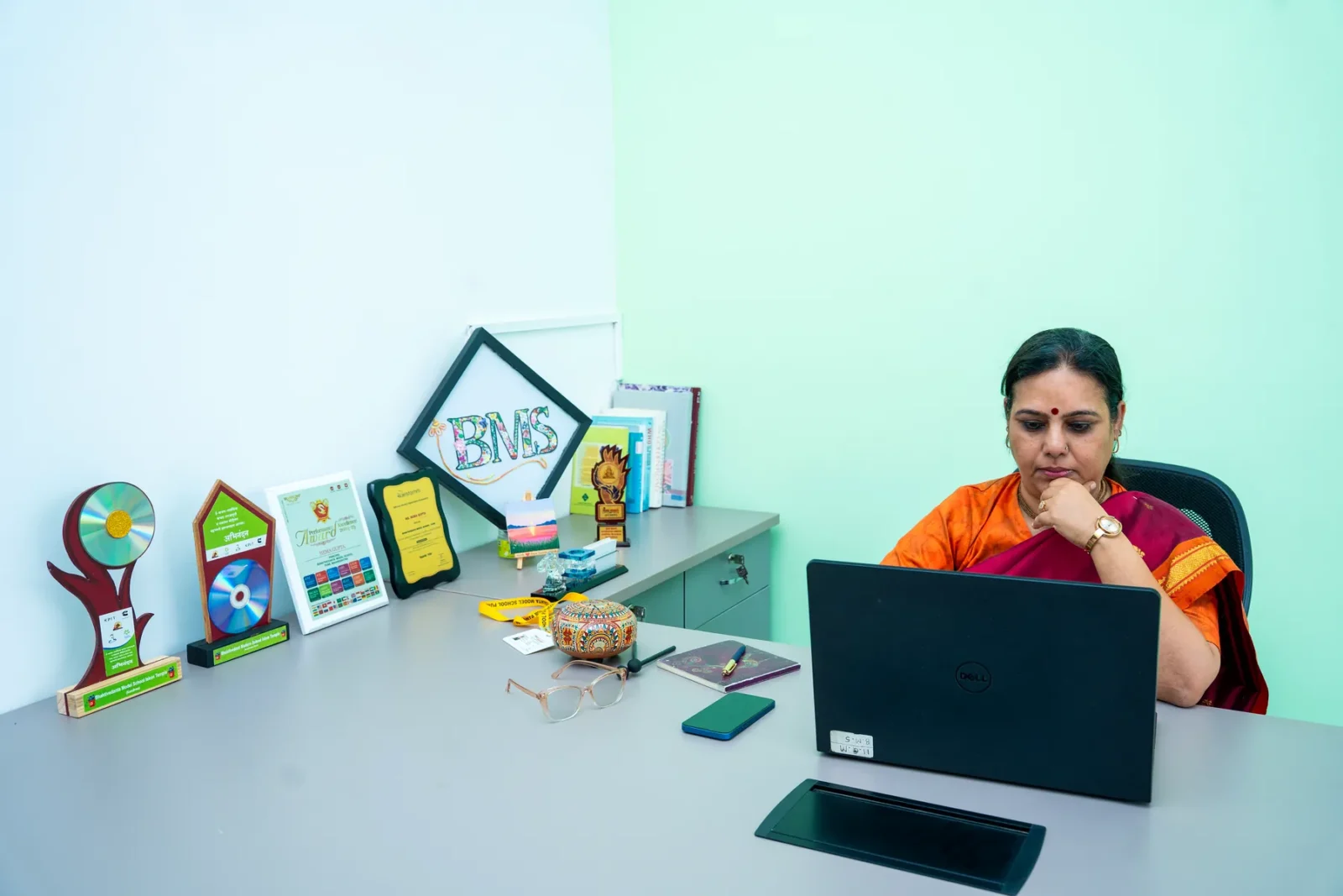 The Principal of Bhaktivedanta Model School at her desk