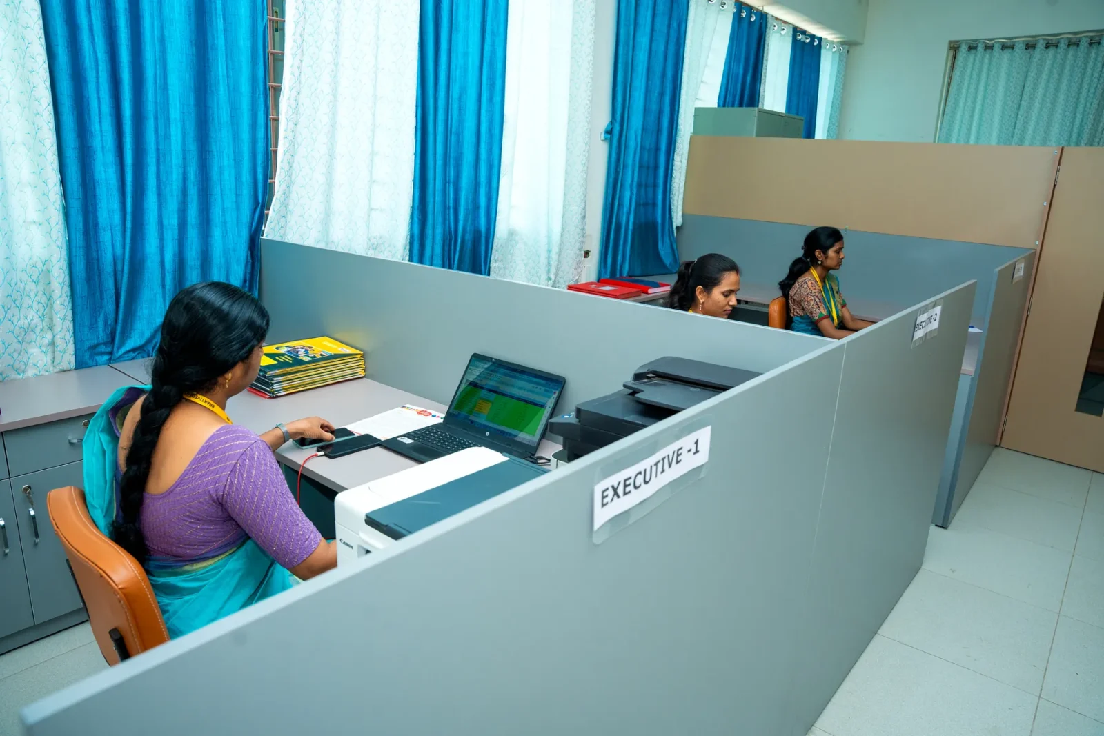 Staff at the reception counter assisting a visitor