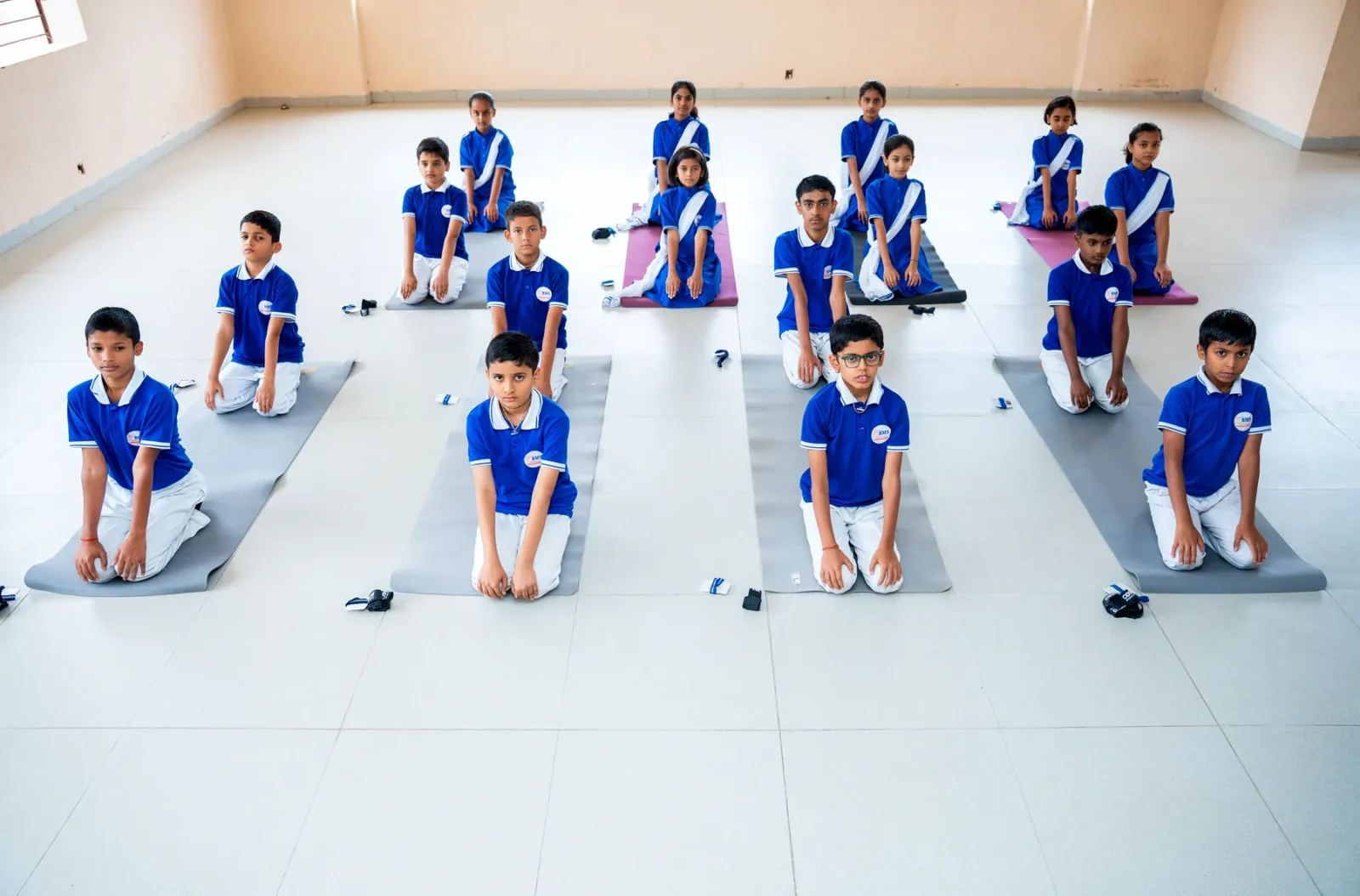 Students during a yoga and floor exercise session in the multipurpose hall
